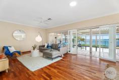 16 Sunset Boulevard Soldiers Point NSW 2317 Discover the ultimate in single level living at this stunning Soldiers Point waterfront. This beautifully designed home offers an exceptional lifestyle with its spacious layout, breathtaking water views and direct beach access. This 4 bedroom, 2 bathroom residence features a modern open plan design that maximises natural light and provides seamless indoor outdoor living. The expansive living and dining areas are perfect for entertaining or relaxing with family, with floor-to-ceiling glass doors that open to a covered patio offering your very own heated swimming pool. The gourmet kitchen is equipped with high-quality appliances and ample storage. The guest suite is a true retreat, elevated upstairs completely separate from the main house, this also features an ensuite bathroom and stunning water views. The additional three bedrooms are generously sized and offer plenty of space for the whole family. Step outside to the covered patio and enjoy the magnificent waterfront views while you relax by your very own indoor pool. The landscaped garden provides a serene backdrop, perfect for outdoor dining and entertaining. Additional features of this property include solar electricity, eclectic gates, massive double lock up garage plus a single carport ensuring plenty of storage space and convenience. Situated in a prime location, this home offers easy access to Soldiers Point Marina which offers two very popular restaurants, local amenities including shops, recreational activities and lots more on offer whilst providing a peaceful and private sanctuary. Embrace a lifestyle of luxury and convenience in this exceptional waterfront home, this is one opportunity not to be missed.