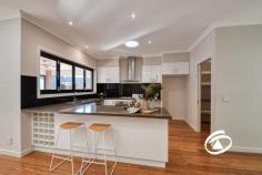 52 Majestic Dr Officer VIC 3809 $1,000,000 - $1,100,000 Constructed with uncompromising quality, this custom-built family home perfectly blends functionality with style. Located on a spacious 719 sqm allotment, this impeccable property showcases luxury finishes making it a premier offering in the popular Grandvue Estate. Boasting fantastic proportions and a functional layout, the home offers multiple living areas, including a formal lounge, sitting room, and a light-filled open-plan living and dining area. The impressive kitchen, ideal for discerning chefs, includes stone benchtops, dual stainless-steel ovens, a dishwasher, a gas cooktop, a walk-in pantry, and a bifold window servery to the outdoor entertaining area. Indoor living flows seamlessly through glass doors to an expansive alfresco area, complete with an outdoor kitchen featuring a built-in BBQ, pizza oven, and ample storage. The master suite is spacious, with access to a private courtyard, two walk-in wardrobes, an additional designer-style dressing area and a large ensuite with a double vanity, oversized shower and separate toilet. The secondary bedrooms are generous in size, equipped with built-in wardrobes, and share convenient access to the main bathroom and separate toilet. A separate study or potential fifth bedroom adds versatility, perfect for those working from home. Additional features include ducted heating, refrigerated cooling, ducted vacuum, three-phase power, oversized remote double garage, and a large laundry. With key amenities at your doorstep like Arena Shopping Complex, Cardinia Train Station, local parks and reserves, and only a stone's throw away from St Francis Xavier College and St Clare’s Primary School, this property’s location will be hard to beat!