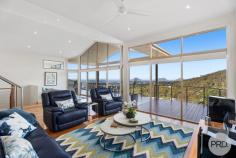 9 Tareebin Road Nelson Bay NSW 2315 Poised atop a hill sits your new home, where luxury meets tranquillity in a stunning modern architect-designed masterpiece. This split-level sanctuary is a testament to meticulous craftsmanship, offering a seamless blend of contemporary design and natural beauty. As you approach, you'll be greeted by lush landscaping that perfectly frames the striking facade of the residence. Step inside to discover a world of refined elegance, where outstanding finishes and meticulous attention to detail create an atmosphere of unparalleled sophistication. Large, picturesque windows adorn the living spaces, offering awe-inspiring views of the headland and the tranquil waters of Port Stephens. Bathed in natural light, the interior boasts polished stringy-bark timber floors and stairs, lending a warm and inviting ambiance throughout. The heart of the home is the modern gourmet kitchen, featuring top-of-the-line Miele appliances and sleek stone benchtops. Whether you're a culinary enthusiast or simply love to entertain, this space is sure to inspire creativity and delight your senses. Step outside onto your spacious balcony, where privacy meets panoramic views. Enjoy alfresco dining or simply unwind as you soak in the breathtaking vistas stretching across Port Stephens and beyond. Retreat to the master bedroom and parents' retreat, complete with a private balcony overlooking the serene nature reserve. The remaining two bedrooms are generously proportioned, offering comfort and convenience with ceiling fans and built-in wardrobes. With a large double lock-up garage and carport providing ample space for vehicles and visitors alike, convenience is never compromised. And thanks to the low-maintenance gardens, you'll have more time to savour the idyllic lifestyle that this property affords. Immerse yourself in the ultimate blend of luxury, comfort, and natural beauty at one of the best-sited properties in Port Stephens. Welcome home to a life of unparalleled tranquility and refinement.