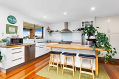 48 Gwinganna Avenue Kiama NSW 2533 $1,700,000 - $1,800,000 Capture the essence of your new oasis in Kiama, close to Kendalls beach with this captivating four bedroom, two bathroom family home. Boasting a spacious open-plan living area that seamlessly connects to a generous front balcony from the kitchen and dining space through to the lush backyard, it is an ideal setting for entertaining guests, unwinding with loved ones or simply relaxing. Key features include: Four bedrooms with built-in wardrobes Separate teenage retreat, currently being run as a boutique holiday stay Serene backyard with a large entertaining patio Small orchard with thriving fruit trees and vegetable gardens Large North-West facing balcony offering picturesque views of rolling hills and Saddleback Mountain Elegant hardwood flooring throughout Nestled in this exclusive, tightly held beachside pocket in Kiama, this residence harmoniously blends indoor comfort with outdoor allure. Whether hosting a summer BBQ or enjoying a peaceful winter sunset, this home provides the perfect backdrop for every occasion.