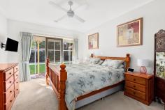 3 Cuneata Close Langwarrin VIC 3910 $880,000 - $925,000 Elegantly appointed, generously sized and curated for lifestyle lovers, this light filled Langwarrin oasis weds family friendly functionality with a host of high end upgrades across an alluring single level design. In a lovely residential estate just a short stroll to Langwarrin Park Primary School and The Gateway shopping mall, the four-bedroom residence sits amid tranquil gardens on an appealing 689m2 (approx) corner allotment. Having recently undergone a stunning modern makeover, the crisp and contemporary abode impresses with a choice of two spacious living areas, each opening to the alfresco, and a formal dining room. An exquisitely appointed cook's kitchen boasts stone benchtops, Asko dishwasher, Bosch induction cooktop, an oven and steam oven, while the woodgrain flooring, plush cream carpeting, light tones, lofty ceiling, exposed brick features and free flowing floorplan conspire to create fresh and inviting spaces. Dual sets of sliding glass doors open to the striking outdoor entertaining area between herringbone brick tiling and a high pitched pergola with a ceiling fan. Backdropped by a romantic outdoor fireplace, the terrace offers a European inspired elegance for exceptional open air hosting. Also spilling out to the garden, the master bedroom is fitted with a walk in robe and private ensuite, while the main bathroom indulges with a freestanding soaker tub, frameless glass shower and a marble vanity. With dual access on the corner block, the property provides both a double garage with a tradie's bathroom, along with an additional garage and caravan storage. Ducted heating, evaporative cooling, a wood heater and solar panels ensure all season comfort with affordability. Zoned for Elisabeth Murdoch College, the property is surrounded by parks, playgrounds, recreational facilities and public transport, around 3km to the freeway for easy commuting.