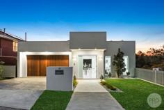 30 LLewellyn Street Oatley NSW 2223 Experience the pinnacle of luxurious living in this exquisite, newly constructed family residence. Impeccably designed to accommodate large and growing families, or those seeking an upgrade to a more opulent lifestyle, this home is a sanctuary of sophistication with panoramic water vistas that promise to captivate and enchant. Nestled in a tranquil, elevated position, each of the five beautifully appointed bedrooms and five modern bathrooms echo the home's commitment to comfort and grandeur. The master suite, a crowning jewel, boasts its own balcony, a spacious walk-in robe, and an elegant ensuite with a freestanding bathtub designed to soak away the stresses of the day against a backdrop of serene water views. The heart of the home is the state-of-the-art kitchen, a triumph of design and functionality with high-end appliances, luxurious stone countertops, and generous storage space. It forms part of the expansive open-plan living and dining area, a testament to modern design that allows for effortless flow between intimate family life and opulent entertaining. Expertly crafted across three levels with solid brick and concrete construction, the home features a versatile floor plan. Whether you desire a secluded study, a private cinema room, or a personal gym, this home offers the space to tailor to your every whim. Outdoor entertaining is equally splendid, with a choice of spaces to enjoy the scenic water views. The large balcony is perfect for alfresco dining or simply relaxing with a glass of wine at sunset, while the lower-level space provides a more intimate setting for gatherings. With a generous 550 square metres of land and a double garage, this property is as practical as it is beautiful. It stands as an unrivalled opportunity for discerning families to own a slice of paradise, where luxury is matched only by the natural beauty of its surroundings. *Solid double brick home featuring five generous bedrooms *Expansive free flowing floorplan drenched in natural light *State of the art kitchen with gas cooking and Smeg appliances *Multiple indoor and outdoor living options *Opportunity for Self Contained Accommodation on Lower Level