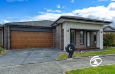 9 Roskopp Ave Clyde North VIC 3978 $630,000 - $670,000 Beautifully maintained inside and out, this modern three-bedroom home presents luxury and low-maintenance living, creating an ideal environment for a relaxed family lifestyle. Nestled in a tranquil enclave within a popular locale, it’s within walking distance to multiple parks and reserves, close to quality schools, and just moments away from shopping facilities and public transport. As you step inside, you'll be welcomed by light-filled interiors that spread across the entire home. A generous hallway leads you past a versatile front living area and opens out to a bright, open-plan living, dining, and kitchen area. Designed to inspire any home chef, the kitchen boasts quality appliances, a gas cooktop, a dishwasher, a walk-in pantry, and a wide breakfast bar. The accommodation comprises three bedrooms. The master bedroom is spacious and equipped with a walk-in wardrobe and ensuite. The secondary bedrooms both have built-in robes and are conveniently serviced by the main bathroom. Glass sliding doors welcome you to a low-maintenance backyard with a mature lush lawn and a concrete patio. Additional benefits include ducted heating, refrigerated cooling, security cameras, double blinds on all windows, a separate laundry, and remote double car accommodation with internal access.