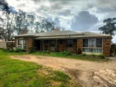 82 Pellew Rd Penfield SA 5121 Discover the charm and potential of 82 Pellew Road, Penfield. This 80s solid brick family home is perfect for a growing family and is set on a generous 4047m² block (approx). Embrace a country lifestyle with ample room for horses, all while being conveniently close to essential amenities. The property offers endless possibilities, whether for industrial or residential use, subject to council approval. Step inside to find a formal lounge featuring a gorgeous bay window and a brick- featured combustion heater, creating a cozy and inviting atmosphere. The large entry is adorned with slate flooring, which extends throughout the home, complemented by ceiling fans in every room. The spacious rumpus room is perfect for family gatherings and entertainment. Accommodation includes three well-appointed bedrooms with built-in wardrobes, while the master bedroom boasts an ensuite for added privacy and convenience. The main bathroom is elegantly designed with floor-to-ceiling tiles. Comfort is assured year-round with ducted evaporative air conditioning and a reverse cycle split system. The kitchen is a standout, with featured brick walls adding character, and a separate built-in bar overlooking the meals area, ideal for casual dining and entertaining. The property also includes a four-car garage, perfect for car enthusiasts or additional storage needs. For those with equestrian interests, the property is equipped with horse stables and a tack room. The huge 30,000-litre rainwater tank ensures ample water supply for the house, with additional tanks servicing the rest of the property. The outdoor entertaining area is perfect for family gatherings and summer barbecues, the pump shed, and garden shed add to the functionality of the space. This property is a unique blend of country charm and modern convenience, offering a versatile lifestyle in Penfield. A great opportunity to explore the endless possibilities with a rezoning proposal at 82 Pellew Road for your future business or make it your dream home.