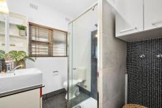Unit 1/322 Anzac Hwy Plympton SA 5038 $500,000-$550,000 Central to city and sea with shops, schools, The Highway Hotel and the bus and tram on your doorstep, this superbly upgraded unit is an absolute must-see for investors or first home buyers. Enjoying the front position within a small corner allotment group, neat timber slatted fences and gated entry add privacy to a secluded front courtyard and porch. Inside, polished timber floors line a contemporary open and airy living, dining and kitchen space, where stunning northerly-aspect glass block windows welcome natural light, and plenty of sleek gloss cabinetry and a mint glass splashback have elevated the cooking quarters, complete with a split system air conditioner for added comfort. Two bedrooms begin with an attractive master option with modern built-in robes and a courtyard outlook, both with easy access to a central bathroom – also having undergone some upgrades – with floating vanity, shower with feature wall and convenient hidden laundry. Outside, a substantial decked alfresco under the protection of a pergola will surprise with its size; the prime possie to entertain or unwind and soak in those stunning summer sunsets. More to mention: - Built-in robes to bedroom 2 - Carport - Large rear shed - Secure private front and rear courtyards