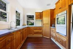 877 Tomewin Road Tomewin NSW 2484 $1,425,000 - $1,475,000 Elevated to capture sweeping views from the acreage all the way to the ocean, this beautifully restored 3-bedroom Art Deco home proudly presides over 3.53 acres of picturesque land. Perfectly located in the tranquil region of Tomewin, NSW, just minutes from the Queensland border, this property offers a secluded oasis surrounded by nature while being just 10 minutes from the vibrant township of Murwillumbah, and a mere 20 minutes drive from Currumbin surf beaches. The iconic bow window in the primary living room is the perfect spot to stand in the late morning sunshine, gazing across the valley to the ocean. Behind you, a gentle fire crackles in the fireplace, filling the air with comforting warmth. Beneath your feet, the Rosewood and Teak floorboards were milled on site at the time of the build, reminding you of the history and character woven into this serene home. Natural light floods into the generous dining area to complete this open-plan zone. Just steps away, the sit-in kitchen offers a more intimate space for family to gather while meals are prepared. Timber cabinetry, ample storage, electric white goods and sash windows overlooking the lush acreage will make time in this space a joy. Moving into the sleeping zones of the home, the king-sized master bedroom delivers stunning ocean views with original timber flooring and detailed cornicing. The second bedroom also boasts ocean views, while the internal third bedroom features beautiful French doors, and opens onto the sun filled second living space. The three bedrooms are serviced by the master bathroom, which retains original features including a pedestal vanity, shower, bath, and cabinetry, with decorative windows. The toilet is separate, positioned adjacent to the spacious laundry. Gaze out the windows from this space to see a pathway to the Hills Hoist, and the dam beyond. While the original design features of this home have been beautifully preserved, recent renovations seamlessly blend the old with the new. The side veranda has been enclosed to provide additional living space for the modern family to enjoy. Here, decorative windows blend with modern glazing to capture the morning sun, acreage and ocean vistas. This room flows onto a vast expanse of grassed yard, with a wood burning barbecue and the rainforest beyond. To the rear of the property, a covered alfresco area provides a perfect spot for entertaining, or for buyers with renovation in mind, this area offers an opportunity for extension within the home's existing footprint. The land features a combination of vast expanses of gently undulating grassed areas, surrounded by rainforest. An abundance of flora and fauna abounds, while a spring-fed dam, three rainwater tanks, and a two car shed, complete the land. With spaces that offer an opportunity for building a second dwelling, creating sustainable living or hobby farming, or simply escaping the hustle and bustle to live surrounded by nature, this home offers the ideal blend of seclusion and convenience. FEATURES - HOUSE Stunning 1950s Art Deco home with preserved design features including timber floors of various origins, detailed cornicing, ornate windows, and a wood-burning fireplace. 3 bedrooms, two with ocean views. 1 bathroom with shower, bath, and separate toilet. Huge open-plan living and dining area with a bow window offering acreage, valley, and ocean views, two-toned timber floors, fireplace, and dining zone. Second living area/sunroom with ocean, valley, and acreage views Spacious sit-in kitchen with generous timber cabinetry, sash windows overlooking the acreage towards the dam, and electric appliances. Separate two-car shed. 1.2kw solar system. FEATURES - LAND 3.53 acres comprising three lots. Areas of rainforest and gently undulating grassed expanses. An abundance of fruit trees, including lychee, orange, lemon, avocado, curry leaf, and macadamia trees. Various native trees and flowers, including cedar, pine, palm varieties, floss silk oak tree, azalea, camellia, and birds of paradise. Spring-fed dam with bore pump. 3 rainwater tanks servicing the house, combining a total of approximately 80KL. Driveway access from Tomewin Road and Garden of Eden Road. LOCATION: Dungay Public School - 7 mins approx Currumbin Valley State School - 10 mins approx Coles Murwillumbah - 12 mins approx Murwillumbah High School - 12 mins approx Currumbin Eco Village - 12 mins approx Wollumbin High School - 16 mins approx The Pines Shopping Centre Elanora - approx 22 mins Currumbin Beach - 25 mins approx Gold Coast Airport - 28 mins approx Kingscliffe - 28 mins approx The true ambiance of this stunning location must be experienced firsthand. Viewings are very highly recommended to fully appreciate the beauty and serenity of this exceptional property.
