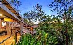 16 Summerhill Court mudgeeraba QLD 4213 $1,549,000 Nestled high in the treetops of Mudgeeraba, this unique 3-story pole home seamlessly blends rustic charm with modern living. Providing an idyllic escape, this stunning property is just minutes away from urban conveniences and the pristine beaches of the Gold Coast. The heart of this home boasts a generous living area with gorgeous high-raked ceilings and large windows that flood the space with natural light, creating a warm and inviting ambiance. Complete with a cozy fireplace, this room is perfect for family gatherings or quiet evenings, providing warmth and comfort all year round. Flowing up the stairs from the living area is the spacious, character-filled master suite loft - featuring a newly renovated ensuite bathroom and study nook. And on the main level, another guest suite with private bedroom and main bathroom, complete with high ceilings and spa bath. The huge country-style kitchen is perfect for cooking up a storm. Equipped with modern appliances and ample counter space, this kitchen is both functional and charming. Relax and unwind on the expansive deck, where you can enjoy stunning sunsets and entertain friends and family. The deck provides a perfect outdoor space to soak in natural beauty and mountain tops in the distance. The lower level features three bedrooms, a living area, bathroom, and a kitchenette, complete with a separate entrance and wrap-around verandahs. This self-contained space is perfect for extended family, guests, or rental income, offering complete independence and privacy. Set on a spacious 2,228m² block, there's plenty of room to explore and enjoy outdoor activities. This private bushland paradise offers the freedom to create your own oasis, with ample space for gardens, play areas, or simply enjoying nature. Key Features: - Massive 5 bedroom, 3 bathroom home - Master bedroom loft with ensuite - Expansive living area with large windows and cozy fireplace - Country-style kitchen with modern appliances - Dual living capabilities: lower level with separate entrance and wrap around verandah - Expansive deck with amazing sunset and hinterland views, right through to Springbrook. - Large 2,228m² block for outdoor activities or subdivision STCA - Wildlife abounds - Koalas, Wallabies, Possums & King Parrots. - Fully fenced area for pets - Flat area for veggies and fruit trees with town water supply and a wood shed / compost area - Paved courtyard for fire pit in the winter, or cool summer evening BBQ's Experience the tranquility of acreage living while being conveniently walking distance to Mudgeeraba Village - with a Coles, Woolworths, Chemist, Jetts Gym and so many cafes and restaurants, you'll never need to leave! This prime location also offers the best of both worlds, being only 15 minutes to the beach and 5 minutes from Robina, you'll have access to elite private schools, a state-of-the-art hospital, and the bustling Robina Town Centre. Everything you need is within easy reach. Embrace the great outdoors with nearby parks, trails, and nature reserves. Enjoy hiking, biking, or simply taking in the beauty of the natural surroundings. This unique property offers a rare opportunity to enjoy serene, private living with all the amenities you need just a short drive away. Don't miss out on the chance to make this beautiful home your own.