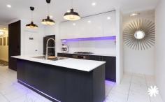 14 Leonharte St Beckenham WA 6107 $800,000 Experience modern living at its finest with this stunning residence, boasting sleek and contemporary design elements that blend quality and value seamlessly. Built in 2017, this stylish home offers the low-maintenance, easy-care lifestyle that today’s families crave in a competitive market. Spacious and ready for immediate move-in, it’s the perfect home for families seeking comfort and convenience. This beautifully presented home with high ceilings features four bedrooms, a theatre room, and three bathrooms, all situated on a highly convenient 418sqm green title block. Designed for modern comfort and practicality, the property includes two large master bedrooms, each with its own ensuite, making it ideal for multi-generational living. Bedrooms two and three come with built-in robes, providing ample storage. The well-appointed main bathroom, with a bath, shower, and vanity, is perfect for relaxation. A separate WC and a laundry off the kitchen, with more storage space that has access to the side yard, adding to the home’s functionality. The kitchen is a culinary delight, featuring abundant storage, a walk-in pantry, overhead cupboards, top-of-the-line stainless steel appliances, a sleek dishwasher, and stunning LED lighting. With a 900mm 5-burner gas stove and a 900mm oven, the kitchen overlooks the open-plan living and dining area, making it perfect for entertaining guests, family, and friends. Added extras include a double garage with rear yard access, a split system air conditioning throughout the home, 3-phase power, security cameras, a safe, and to keep up with your future car a 3-phase electric car charger in the garage for overnight charging. Outside, the home continues to impress with a lovely alfresco area under the main roof, for entertaining or enjoying a quiet evening meal. A charming gazebo to relax and enjoy family time. The synthetic lawns ensure low-maintenance gardening, keeping life at a slow pace. Location is key, and this home delivers. It’s close to Beckenham Train Station for easy commutes around the metro area, and Westfield Carousel, with its vast array of shops, entertainment, and dining options, is just a short drive away. Enjoy seamless access to Welshpool Road, Albany Highway, and the nearby Cannington central business district for all your shopping needs. With a playground opposite your new home, children and pets will have entertainment right at your doorstep. With Perth CBD just a short 20-minute commute away, don’t miss the opportunity to make this well-presented home yours. Why build, when this home is ready for your family now?