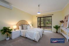 385 Mueller Pl Hovea WA 6071 $1,100,000Escape to tranquillity in this exquisite 4-bedroom, 2-bathroom plus study home in the heart of Hovea, Perth Hills. Nestled high on 2.47 acres overlooking the beautiful Hovea Valley and nearby John Forrest National Park, this is a nature lover’s dream! Built in 2001 by Rural Building Co, this property offers an unparalleled lifestyle where nature’s beauty meets modern hills living. 4 bedrooms, 2 bathrooms + study Soaring ceilings, timber features 2001 build by Rural Building Co Amazing timber deck/entertaining area Colorbond Workshop Open-plan kitchen, living and dining area Duct rev/cycle a/conditioner plus S/system 1 hectare of pristine bushland House located on a quiet no-through road 35-minute drive to Perth City A spacious living area with high ceilings and an open-plan design sets the tone for this modern home. The living and dining areas flow seamlessly, creating a perfect space for family gatherings and entertaining. The house is equipped with a split system and reverse cycle air conditioner, ensuring comfort year-round. Step onto the expansive outdoor deck, a perfect haven for entertaining and relaxation. This beautifully designed space offers ample room for alfresco dining, lounging and hosting gatherings with family and friends. Surrounded by greenery and overlooking the serene landscape, the deck seamlessly blends the comfort of home with the tranquillity of nature. Whether you’re enjoying a quiet morning coffee, a lively BBQ or an evening under the stars – this outdoor feature enhances your lifestyle with its charm and versatility. Discover a sprawling backyard that blends effortlessly into its surroundings. With 1 hectare of land, there’s plenty of room for outdoor activities, gardening or simply enjoying the serenity of nature. The property offers beautiful wildlife and scenic beauty. Despite its serene setting, the property is only a 35-minute drive from Perth City, offering the perfect balance between peaceful country living and urban convenience. Wake up to the sound of native birds and the rustling of gum trees. The green landscape provides a calming backdrop, ideal for those seeking a retreat from the hustle and bustle of city life. Hovea is known for its close-knit community and relaxed lifestyle. Enjoy the benefits of country living – every window in the house frames a picturesque view of the natural landscape, with majestic gum trees and the soothing sounds of native wildlife providing a scenic backdrop.