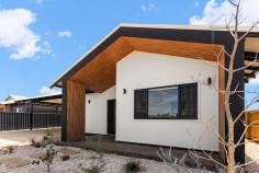 91 Tanami Drive Bilingurr WA 6725 $939,000 If you've been dreaming of building the ultimate luxury family home but don't want to wait for construction, here's one we prepared earlier. Built by Connolly Homes and never lived in, this stunning, brand-new family home redefines modern, luxury living in the Kimberley. And you'll soon discover why. Winner of the Master Builders WA Best Kimberley Country Home Builder award in 2023 and 2024, Connelly Homes has created a no-expense spared residence, delivering the highest quality of living throughout. From the Venetian render and feature splashback windows to the honed aggregate alfresco and custom cedar-look raked entryway, you'll notice superior, high-end finishes that you simply won't find anywhere else in Broome. It all starts from the front, with the home's stand out, eye-catching façade setting the standard for what is to come. Behind the electric gated entry, you'll find the large double carport with secure parking for two vehicles and plenty of additional driveway parking available. You enter the home via the beautiful raised concrete portico with feature render and stunning raked pine ceiling. Inside is nothing short of spectacular. The interior boasts spacious open-plan living and dining with feature wood flooring, high ceilings, and abundant natural light thanks to the feature splashback windows. At the heart of the home is the modern Chef's kitchen complete with huge scullery, stainless steel appliances (all under warranty), stone benchtops, feature hanging lights, soft-close drawers, near endless cupboards and drawers and a big island breakfast bar. With a meticulously well-thought-out floorplan, the entry drop zone with bench seating and study desk offers functionality, as does the laundry location, with access to the rear from the scullery and plenty of built in cabinetry. Every detail has been carefully considered in both of the stunning bathrooms, with the main bathroom boasting a hob-less shower, invisible drainage and a freestanding bath. The home itself boasts 4 big bedrooms, all with built-in robes and air-con, including the spacious and stylish Master suite, complete with walk-in his and hers robes, louvre windows and a massive private ensuite, carrying through the feature Venetian rendering and stylish tiling, offering built in shower shelving. Beautifully crafted inside and out, the honed aggerate alfresco with three ceiling fans, is purpose-built for entertaining, overlooking the expansive rear yard with plenty of lush green grass for the kids and pets to play. There's a stunning Mandi toilet with, a big lock-up workshop/shed for all your tools and toys, and more than enough room to sink a large pool if you desire. Located within walking distance to a number of local parks with fantastic playground equipment, and close to the new Broome North Primary School and Cable Beach, it's the vibrant, community style living you've been searching for in a truly stunning home.