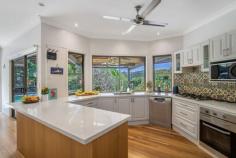 29 Durobby Drive Currumbin Valley QLD 4223 $2,250,000 With the promise of laid-back living in a secluded hinterland setting, this gorgeous property is your own tranquil slice of paradise. Set back from the road and presiding over more than 5000sqm of lush grounds abundant with a plethora of tropical fruit trees, this stunning family haven delivers a resort-style luxury lifestyle with all amenities close by. A soft natural palette combines with high ceilings and timber flooring throughout to create an inviting light filled ambience. The generous floorplan provides room for everyone, including a massive sunken living room with fire place for those cooler nights and the separate pool room, accessed via bifold doors, is an ideal party space. Cater for a crowd in the centrally located kitchen, well-appointed with 5 burner gas cooktop and electric oven, then head outdoors to an expansive covered patio, the perfect venue for grand scale celebrations. Spend time with the family, as you enjoy a refreshing dip in the shimmering pool, then laze the hours away on the deck amidst the lushness of the surrounding tree ferns, palms and gum trees. Four bedrooms and three bathrooms are also on the layout, the super-sized master suite with walk in robe and opulent ensuite, also has patio access and offers a serene sanctuary for rest and relaxation. Upstairs a kids retreat with two huge bedrooms, play area and bathroom allows for peaceful family life and a further bedroom on the lower level is serviced by the large main bathroom. Additional features include access to town water, Envirocycle system and a watertank for irrigation. There is also a 5Kw 20 panel solar system and the double garage and hardstand area provide room for all the vehicles. Idyllic living and superb convenience go hand in hand on the southern Gold Coast, where Currumbin Creek and Currumbin Alley are close by for stand-up paddle boarding and swimming and the Burleigh surf break is a short drive away. Multiple schools including Tallebudgera State School and St Augustine's Parish Primary are within a 10 minute drive and all your shopping needs can be met with Currumbin Fair Shopping Village and The Pines nearby. Property specifications Main features - Gorgeous acreage property nestled on over 5000sqm - High ceilings, timber floors and led lighting throughout - Four bedrooms and three bathrooms spanning two-levels - Huge sunken living room with fireplace and spacious dining, both with patio access - Modern kitchen with Caesarstone benchtops, gas cooktop, electric oven - Large pool room/2nd living area with built-in speakers - Huge outdoor living and resort-style pool with deck offers lush tropical outlook - Master suite with walk-in robe, ensuite with dual rainhead shower and patio access - Kids retreat with two bedrooms, play space and bathroom Other features - Double garage and hardstand for further vehicles - Tropical trees and plants including mango, citrus, avocado, ginger and macadamia - 5Kw 20 panel solar system - Access to town water and watertank for irrigation - Envirocycle Location - 10 minute drive to local schools - Retail options nearby at Currumbin Fair Shopping Village and The Pines - Short drive to Currumbin Creek and Currumbin Alley