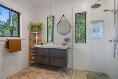29 Durobby Drive Currumbin Valley QLD 4223 $2,250,000 With the promise of laid-back living in a secluded hinterland setting, this gorgeous property is your own tranquil slice of paradise. Set back from the road and presiding over more than 5000sqm of lush grounds abundant with a plethora of tropical fruit trees, this stunning family haven delivers a resort-style luxury lifestyle with all amenities close by. A soft natural palette combines with high ceilings and timber flooring throughout to create an inviting light filled ambience. The generous floorplan provides room for everyone, including a massive sunken living room with fire place for those cooler nights and the separate pool room, accessed via bifold doors, is an ideal party space. Cater for a crowd in the centrally located kitchen, well-appointed with 5 burner gas cooktop and electric oven, then head outdoors to an expansive covered patio, the perfect venue for grand scale celebrations. Spend time with the family, as you enjoy a refreshing dip in the shimmering pool, then laze the hours away on the deck amidst the lushness of the surrounding tree ferns, palms and gum trees. Four bedrooms and three bathrooms are also on the layout, the super-sized master suite with walk in robe and opulent ensuite, also has patio access and offers a serene sanctuary for rest and relaxation. Upstairs a kids retreat with two huge bedrooms, play area and bathroom allows for peaceful family life and a further bedroom on the lower level is serviced by the large main bathroom. Additional features include access to town water, Envirocycle system and a watertank for irrigation. There is also a 5Kw 20 panel solar system and the double garage and hardstand area provide room for all the vehicles. Idyllic living and superb convenience go hand in hand on the southern Gold Coast, where Currumbin Creek and Currumbin Alley are close by for stand-up paddle boarding and swimming and the Burleigh surf break is a short drive away. Multiple schools including Tallebudgera State School and St Augustine's Parish Primary are within a 10 minute drive and all your shopping needs can be met with Currumbin Fair Shopping Village and The Pines nearby. Property specifications Main features - Gorgeous acreage property nestled on over 5000sqm - High ceilings, timber floors and led lighting throughout - Four bedrooms and three bathrooms spanning two-levels - Huge sunken living room with fireplace and spacious dining, both with patio access - Modern kitchen with Caesarstone benchtops, gas cooktop, electric oven - Large pool room/2nd living area with built-in speakers - Huge outdoor living and resort-style pool with deck offers lush tropical outlook - Master suite with walk-in robe, ensuite with dual rainhead shower and patio access - Kids retreat with two bedrooms, play space and bathroom Other features - Double garage and hardstand for further vehicles - Tropical trees and plants including mango, citrus, avocado, ginger and macadamia - 5Kw 20 panel solar system - Access to town water and watertank for irrigation - Envirocycle Location - 10 minute drive to local schools - Retail options nearby at Currumbin Fair Shopping Village and The Pines - Short drive to Currumbin Creek and Currumbin Alley