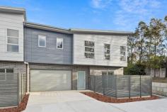 9/18 Phillips Avenue West Wollongong NSW 2500 $895,000 Embrace a carefree, suburban lifestyle with these meticulously crafted town homes located in the heart of Wollongong. A great place to put down roots, each offering three well-proportioned bedrooms including a spacious main with walk-in wardrobe, a tastefully-designed kitchen with stone benchtops, lock-up garage and a peaceful courtyard, where you can enjoy a morning cuppa or simply take a well-deserved time out from the hustle and bustle of the day. Providing a neutral canvas for you to make the space your own, this light-filled residence offers families of all ages and stages the opportunity to be the first to call this delightful town house a home. Features • High ceilings throughout main living areas • Ducted reverse-cycle A/C upstairs and down • two bathrooms, 1 downstairs and 1 upstairs • Large bedrooms with built in robes • Second sitting room upstairs, under stair storage • Situated in a lush cul-de-sac, moments to the CBD