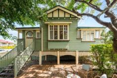 5 Elliott Street Hawthorne QLD 4171 A quintessential Queenslander in the heart of Hawthorne, where the best of the suburb's cafes, boutiques and parks are only metres away, as is a CityCat into Brisbane's CBD. This gorgeous character home, on a prime corner 422sq m parcel of riverside precinct land, offers a plethora of opportunities beyond its current form. As it stands is a mostly original two-bedroom, one-bathroom single-level home, perched on stilts, and framed by a quaint timber picket fence. Beyond a front deck in the shade of large mature trees, a set of front steps leads into an interior of soaring 3.1m-high ceilings, VJ walls, original timber floors, period and stained glass windows and architraves, and French doors. The central kitchen is the heart of this welcoming home, a more contemporary space of stainless benchtops, gas cooking, and ample storage. It services an open-plan living/dining area and adjacent north-facing covered timber entertaining deck which overlooks the yard below. A generous primary bedroom features a bay window seat and French doors, with an additional bedroom is both light-filled and well-sized. The spacious main bathroom has a dual-sink stainless steel vanity and beautiful feature tile flooring. There's also a large sunroom that would make for an ideal study/home office, or a nursery alongside the primary bedroom. The clincher is the future return on offer here, as there's a lapsed DA for commercial use which reflects opportunity beyond residential gain. Keen renovators will appreciate the location, being a gateway to the exclusive Hawthorne avenues, and the aspect of impressive city views if the house was to be raised (STCA). Alternatively, young families and couples can comfortably reside in this Queenslander as is, while enjoying a friendly village-like lifestyle unlike any other in Brisbane. Within walking distance of Hawthorne Garage, Hawthorne cinemas, SISTA cafe, bustling restaurants, Hawthorne Park and a CityCat, 5 Elliott Street offers but is not limited to; + Century-old Queenslander on a prime 422sqm corner parcel of land + North-facing entertaining deck overlooking yard with room for a pool + Capitalise on the (lapsed) DA for commercial use + Renovate and raise to enjoy CBD views (STCA) + Entry-level riverside precinct opportunity offering Hawthorne avenues access + Original timber floors, 3.1m-high ceilings, VJs, period architraves + Extra large bedrooms, sunroom/study and main bathroom, portico/study nook + Central kitchen of stainless steel benchtops, gas cooking, ample storage + Bifold doors, French doors, bay window, split-system air-conditioning + Fenced gardens/lawn, tandem off-street parking, covered space for boat + Walk to Hawthorne's finest offerings, as well as popular Oxford Street + 850m to Hawthorne ferry terminal and Hardcastle Park + 1.1km to Lourdes Hill, 450m to Sts Peter and Paul's, Morningside SS zone + Minutes to Cannon Hill Anglican College and Churchie + Nine minutes by car into the CBD, 25 minute bike commute.