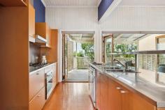 5 Elliott Street Hawthorne QLD 4171 A quintessential Queenslander in the heart of Hawthorne, where the best of the suburb's cafes, boutiques and parks are only metres away, as is a CityCat into Brisbane's CBD. This gorgeous character home, on a prime corner 422sq m parcel of riverside precinct land, offers a plethora of opportunities beyond its current form. As it stands is a mostly original two-bedroom, one-bathroom single-level home, perched on stilts, and framed by a quaint timber picket fence. Beyond a front deck in the shade of large mature trees, a set of front steps leads into an interior of soaring 3.1m-high ceilings, VJ walls, original timber floors, period and stained glass windows and architraves, and French doors. The central kitchen is the heart of this welcoming home, a more contemporary space of stainless benchtops, gas cooking, and ample storage. It services an open-plan living/dining area and adjacent north-facing covered timber entertaining deck which overlooks the yard below. A generous primary bedroom features a bay window seat and French doors, with an additional bedroom is both light-filled and well-sized. The spacious main bathroom has a dual-sink stainless steel vanity and beautiful feature tile flooring. There's also a large sunroom that would make for an ideal study/home office, or a nursery alongside the primary bedroom. The clincher is the future return on offer here, as there's a lapsed DA for commercial use which reflects opportunity beyond residential gain. Keen renovators will appreciate the location, being a gateway to the exclusive Hawthorne avenues, and the aspect of impressive city views if the house was to be raised (STCA). Alternatively, young families and couples can comfortably reside in this Queenslander as is, while enjoying a friendly village-like lifestyle unlike any other in Brisbane. Within walking distance of Hawthorne Garage, Hawthorne cinemas, SISTA cafe, bustling restaurants, Hawthorne Park and a CityCat, 5 Elliott Street offers but is not limited to; + Century-old Queenslander on a prime 422sqm corner parcel of land + North-facing entertaining deck overlooking yard with room for a pool + Capitalise on the (lapsed) DA for commercial use + Renovate and raise to enjoy CBD views (STCA) + Entry-level riverside precinct opportunity offering Hawthorne avenues access + Original timber floors, 3.1m-high ceilings, VJs, period architraves + Extra large bedrooms, sunroom/study and main bathroom, portico/study nook + Central kitchen of stainless steel benchtops, gas cooking, ample storage + Bifold doors, French doors, bay window, split-system air-conditioning + Fenced gardens/lawn, tandem off-street parking, covered space for boat + Walk to Hawthorne's finest offerings, as well as popular Oxford Street + 850m to Hawthorne ferry terminal and Hardcastle Park + 1.1km to Lourdes Hill, 450m to Sts Peter and Paul's, Morningside SS zone + Minutes to Cannon Hill Anglican College and Churchie + Nine minutes by car into the CBD, 25 minute bike commute.