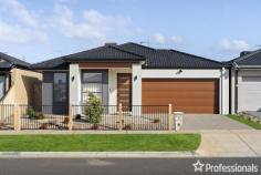 38 Sedate Dr Rockbank VIC 3335 $650,000-$710,000 Welcome to your dream home! This beautifully maintained 4 -bedroom, 2-bathroom residence is located in the beating heart of Rockbank, offering both comfort and style. With well-designed living space, this property combines charm with modern conveniences. Key Features: Spacious Living Areas: The open concept living and dining areas are perfect for both everyday living and entertaining guests. Enjoy cozy evening gatherings in the spacious dining area for family meals. Gourmet Kitchen: The updated kitchen boasts 900 mm stainless steel appliances, granite countertops, custom cabinetry. It’s a chef’s dream with ample storage and Island bench for casual dining. Serene Bedrooms: Retreat to the master suite, which features walk-in closet and en-suite bathroom. The additional bedrooms are generously sized and versatile, ideal for a growing family or a home office with built in Robes. Modern Bathrooms: All the Bathrooms are modernized with wall to Floor tiles and Black Finish Fixtures. Prime Location: – Rockbank primary school 5 minutes’ drive. – Rockbank Railway Station 3 minutes’ drive. – Day care just walking distance – few minute’s drive to Bacchus Marsh Grammar School – few minute’s drive to Woodlea Town Centre. Additional Highlights: Solar System Installed Tailored Sheers Installed to the Windows. Enjoy the peaceful lifestyle you have been looking for with the added bonus of a convenient location – Located next to all your upcoming future amenities, public transport and walking tracks/reserves/parklands, this outstanding home is unquestionably something you would be proud to call home. Come and view this elevated and elegant family home that’s certain to attract an assortment of potential buyers. Professionals real Estate team welcomes you and looks forward to servicing your real estate needs.