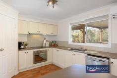 9 Truslove St Wooroloo WA 6558 $629,000 Stylish, spacious and sophisticated, this two-storey Wooroloo home boasts multiple living areas, a first-floor parents’ retreat and the natural beauty of the Perth Hills on the doorstep. Set in a small estate at the edge of town, within walking distance of the local primary school and the Heritage Trail, this impeccably presented property is a dream made real for young families or anyone looking to escape suburbia. 3 bedrooms 2 bathrooms 2012-built Hardi and iron open plan w in-out flow Formal lounge/media rm First floor parents’ retreat Big separate office/studio Wrap around verandahs Decked alfresco AG pool 1/2 acre adjoining reserve Walk to school and Trail With its unmistakable Queenslander façade and en-point styling, this Hills home is a winner. It has a fantastic flowing floorplan, rooms awash with natural light, a wonderful sense of space and seamless indoor-outdoor flow upstairs and down. The front door opens to a central open plan with wide board wood-look flooring and a light modern colour palette bringing a sense of timeless style. This quiet, understated sophistication continues across the home from the subtly country-style kitchen to the welcoming formal lounge/media room and up to the parents’ retreat occupying the entire first floor. The central living zone melds seamlessly with a large decked entertaining area and an extension of the wrap-around verandah. The kitchen features cream cabinetry, a wrap-around bench, and an integrated breakfast bar surrounding a dishwasher, oven and induction cooktop. Sliding glass doors connect the meals area with the outdoor entertaining zone. Double doors in the family room expand the living space into a plush and welcoming lounge/media room – the perfect place to cosy-up on a big squishy sofa. Adjoining the lounge is a home office/study. This generous space uses a neutral palette and east-facing window framing views of the pool and the adjoining reserve to deliver the perfect quiet space for uninterrupted work or study. Two junior bedrooms, a family bathroom, a walk-through laundry and a walk-in linen press occupy the south of the plan. The bedrooms have built-in robes; one has direct access to the front verandah, and the other looks across the backyard and pool to the reserve. Carpeted stairs ascend to the light-filled parents’ retreat, a serene oasis with a private balcony, a walk-in robe, ensuite and ample room for a seating area. A soft, calming palette, carpet underfoot, reverse cycle air conditioning and swathes of natural light fashion an utterly delightful grownups’ retreat. Fully fenced with drive-in access along one side, the ½ acre lot offers a blank slate with ample room to build a workshop, plant a home orchard, grow vegetables and even keep chickens. The above-ground pool is a natural focal point during the warmer months and the nearby Heritage Trail offers hours of walking and riding adventures year-round. Wooroloo is a quintessential Hills town with a small general store and easy access to road links to Mundaring and beyond; it sits nestled in the unending beauty of a natural Australian landscape.