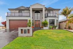 30 Denham Drive Horsley NSW 2530 $1,750,000 - $1,850,000 Nestled in a serene and highly sought-after neighborhood, this grand 5 bedroom, 3 bathroom home offers an unparalleled blend of luxury, comfort, and versatility. Perfect for large families or those who love to entertain, this property boasts an additional 2-bedroom, 1-bathroom granny flat - ideal for extended family, guests, or even a rental opportunity! Main Home Features: 5 Spacious Bedrooms: Including a luxurious master suite with a walk-in closet and large en-suite bathroom with double vanity. Gourmet Kitchen: Outfitted with high-end stainless steel appliances, granite countertops, and an expansive island - perfect for culinary adventures. Multiple Living Areas: Enjoy both formal and casual living spaces, each designed to accommodate your every need. Loft: Ideal as a quiet space for study or possible 6th bedroom. Elegant Dining Room: Perfect for hosting dinner parties and special occasions. Covered Entertaining: A covered patio upstairs and an adjoining expansive balcony providing plenty of space for get-togethers. Granny Flat Features: 2 Comfortable Bedrooms: Offering privacy and comfort for guests or extended family. Fully Equipped Kitchen: Complete with modern appliances and plenty of storage. Open-Plan Living and Dining: A cozy yet spacious area for relaxation and entertainment. Private Entrance: Separate from the main home, ensuring independence and privacy. Additional Highlights: Double Garage: With ample storage space and internal access. Prime Location: Close to top-rated schools, shopping centers, parks, and public transport. Modern Finishes: Throughout both the main house and granny flat, providing a fresh and stylish living environment.