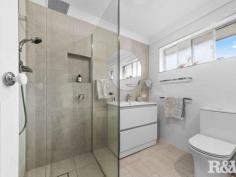 199 Veron Rd Umina Beach NSW 2257 $1,200,000 - $1,250,000 Located in a peaceful curb and guttered street with an amazing bush backdrop is this modernized brick and tile 3 bedroom family home. The property is situated within easy access to Woy Woy train station, St John the Baptist Catholic Primary School, Brisbane Water Secondary College and Everglades Country Club. The home is light-filled throughout and has an open plan design. There are separate living and dining areas, an updated kitchen with loads of storage and dishwasher, 3 large bedrooms with generous robe space, an updated main bathroom with a free-standing tub, along with a single garage and double carport. The surprises continue out in the fully fenced backyard, there is ample space to entertain your guests in the undercover patio area, the landscaped gardens are immaculate and full of colour and there is still plenty of grassed area for the kids and pets to play. Other features of this lovely home include - - Air-conditioned - Level 606 Sqm fully fenced block - Internal laundry with a second toilet - Garden shed - Plantation shutters