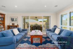 12 Barton Cl Mittagong NSW 2575 $1,395,000 Welcome to 12 Barton Close, a modern retreat at the end of a tranquil cul-de-sac. Surrounded by a beautifully landscaped front garden featuring low-maintenance plantings, the property boasts a bright, north-facing aspect that invites warm sunlight throughout the day. Inside, the home is designed for family living, with an open-plan kitchen, living, and dining area complemented by a separate media room—perfect for movie nights or quiet relaxation. The covered, private alfresco area extends your living space outdoors, making it ideal for year-round entertaining. The bonus "Artist Retreat" at the rear provides an inspiring creative haven for painting, writing, or simply finding your muse. With easy access to Mittagong Town Centre and the Sydney freeway, you can enjoy the peace of your cul-de-sac retreat while remaining close to all essential amenities. Move in, relax, and immerse yourself in the idyllic surroundings of your new home. Features include; Gas ducted central heating | Plantation shutters Laminate flooring | Woollen carpet Kitchen featuring pendant lighting, BLANCO 900mm oven, 900mm gas cooktop, Miele dishwasher and large butler’s pantry Master bedroom with walk-in robe and ensuite Large covered alfresco area NBN fibre to the house 5270L water tank