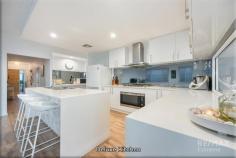 22 Dolphin Dr Alkimos WA 6038 $779,000 The Phil Wiltshire team is proud to present what has to be one of the coolest homes to hit the market this year! Deceptively spacious, this larger-than-life coastal home is immaculately presented from start to finish with a host of modern upgrades that will impress all who are lucky enough to view! Located within walking distance to the beach and all the amenities, this one will surely get the attention it deserves! CALL NOW to submit your offer! Proudly perched in the heart of the highly sought after Alkimos Beach community, this stunning coastal home is conveniently located close to all the amenities. Offering immediate access to local family parks, the Gateway shopping precinct, medical centers, gymnasiums, St James Anglican School + Alkimos Primary School, bars & restaurants, and only a stone’s throw away from the tranquil blue water of the Indian Ocean this is as convenient as it gets! With Alkimos Surf Lifesaving Club community guarding the coastline, you have the perfect place to surf, swim, fish, and take in the beautiful summer sunsets! When it comes to inner city commutes the Alkimos train station & Romeo Road freeway access point is only a 5-minute drive away so why not take advantage. The front elevation of this modern coastal home has been architecturally designed with its striking skillion roof, elegantly slanted to complement the ocean views on the horizon. Opening up to lofty high ceilings, wide hallways and a stylish coastal finish, inviting in natural light and showcasing the home’s open, airy design. With low maintenance gardens, lush green lawns, pebbled surrounds and a giant cactus commanding your attention, this memorable home is instantly appealing to the eye! As the sun sets, the home comes alive with warm hues, reflecting the golden light, creating a picturesque backdrop that perfectly highlights the harmonious blend of architecture and nature. This is a retreat where modern elegance meets coastal charm. Secluded at the front of the home, the super spacious master bedroom boasts a huge walk-in robe, quality carpets, venetian blinds, and tinted windows giving you extra privacy whilst keeping the room at a comfortable temperature all year round. The ensuite is nicely tucked away and finished to a high standard with an extended vanity, oversized double hobless shower, separate water closet, elegant tiles and modern fixtures & fittings throughout. The three minor bedrooms are all queens with double sliding robes making them perfect for both young kids and teenagers alike. Neatly nestled in-between is not only the family bathroom but also an activity room which would make the ideal gaming zone or simply a quiet place to finish off homework and assignments. This stunning deluxe kitchen combines modern elegance with functionality, making it a chef’s dream. Featuring sleek white cabinetry and expansive countertop space complete with waterfall edges, the design oozes both style and practicality. A central island offers plenty of prep space and casual seating, perfect for entertaining or enjoying a morning coffee. Features include state of the art stainless steel appliances + 6 hob burner, mirrored glass splashback, dishwasher and masses of overhead storage. With a hidden walk-in pantry, “drop zone” for all your shopping bags and a handy viewing window you can keep an eye on the kids in the activity room as you prepare evening meals! One of the true selling points of this dream residence is the sophisticated layout and the abundance of living areas at your leisure. Drenched in natural light, the open plan living & dining features lofty high ceilings, stunning wooden floors, fresh neutral decor and an abundance of windows creating a serene and calming coastal vibe! When it comes to chilling out with the family, the enclosed theatre room provides the perfect place to put your feet up and watch your favourite movies & shows in peace! With the addition of the kid’s activity room and a separate study just off the main hallway, you have a home that caters for the growing family lifestyle. Step into your own serene outdoor oasis, thoughtfully designed for relaxation and entertainment. This charming space features pristine synthetic lawns that require minimal maintenance, allowing you to enjoy more time with family and friends. The undercover alfresco area, seamlessly extends from the main living area, is perfect for BBQ’s or cozy evenings under the stars. With ample seating and a laid-back atmosphere, this outdoor area invites you to unwind while soaking in the picturesque surroundings. Extras Include: Double garage (heightened), separate laundry + huge linen, solar panels, solar hot water system, ducted reverse cycle air-con, 1x roller shutter, additional TV + internet points, skirting board, gas bayonet, rear stacker doors, synthetic lawns and so much more! THE SPECIFICS: Year Built: 2016 Land Area: 420sqm Build Area: 197sqm Builder: Choice (Projex)