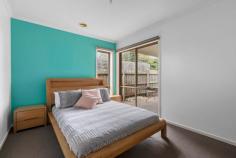 2/5 Rosslyn Avenue Seaford VIC 3198 $650,000 - $690,000 Discover the perfect blend of modern elegance and low-maintenance living in this superbly designed three bedroom home, ideally situated to enjoy leisurely bike rides and scenic walks along Kananook Creek reserve, with Seaford beach just beyond. Nestled at the rear with only two on the block, this home boasts a delightfully spacious single-level floor plan. The formal living room is complemented by a split system heating and cooling, ensuring year-round comfort. The well-appointed kitchen features stainless-steel appliances including gas cooking and breakfast bar that overlooks the adjoining dining. Here, glass sliding doors open out to an undercover private decking area, perfect for indoor/outdoor entertaining. The master bedroom offers the convenience of a walk-in robe and private ensuite, while the two additional bedrooms feature built-in robes and share a central family bathroom with a separate bath and shower. A separate laundry provides internal access to the remote double lock-up garage, adding to the home's practicality. Offering a lifestyle of unmatched convenience and exuding contemporary elegance with a focus on style and quality, this home makes an ideal choice for those seeking an easy-care lifestyle in a highly desirable Seaford location.