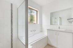 2/5 Rosslyn Avenue Seaford VIC 3198 $650,000 - $690,000 Discover the perfect blend of modern elegance and low-maintenance living in this superbly designed three bedroom home, ideally situated to enjoy leisurely bike rides and scenic walks along Kananook Creek reserve, with Seaford beach just beyond. Nestled at the rear with only two on the block, this home boasts a delightfully spacious single-level floor plan. The formal living room is complemented by a split system heating and cooling, ensuring year-round comfort. The well-appointed kitchen features stainless-steel appliances including gas cooking and breakfast bar that overlooks the adjoining dining. Here, glass sliding doors open out to an undercover private decking area, perfect for indoor/outdoor entertaining. The master bedroom offers the convenience of a walk-in robe and private ensuite, while the two additional bedrooms feature built-in robes and share a central family bathroom with a separate bath and shower. A separate laundry provides internal access to the remote double lock-up garage, adding to the home's practicality. Offering a lifestyle of unmatched convenience and exuding contemporary elegance with a focus on style and quality, this home makes an ideal choice for those seeking an easy-care lifestyle in a highly desirable Seaford location.
