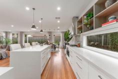 27 Drew St Yarraville VIC 3013 $2,200,000 - $2,300,000 Discover the perfect blend of luxury, comfort, and community in this stunning Hamptons-style home, just six years young and brimming with top-tier features. With five spacious bedrooms and two beautifully appointed bathrooms, this residence is designed for modern living and entertaining on a grand scale. At heart of the home, the kitchen is a chef's dream, boasting stone benchtops, premium appliances, and a butler's pantry, making it an ideal space for culinary creations. The expansive open-plan living areas flow seamlessly into the decked alfresco space, thanks to elegant bi-fold doors. Imagine hosting family and friends with ease, whether it's enjoying a slice from the wood-fired pizza oven, dining on the deck, or unwinding in the outdoor entertainment area. The home is a sanctuary for families, with ducted heating and cooling ensuring year-round comfort, and gorgeous hardwood flooring adding a touch of sophistication. The remote double garage offers convenience and security, while the quiet location at the Parkside end of Drew Street provides a serene setting where a council caveat protects the area from subdivision, preserving the neighbourhood's charm and exclusivity. Children will love the ample outdoor space, perfect for a game of basketball in the driveway or an afternoon at Angliss reserve. The friendly, tight-knit community makes it a welcoming place to call home, and pet owners will appreciate the proximity to various dog parks. Education is a breeze with safe walking routes to both Wembley and Kingsville Primary Schools, while Cruickshank Park, just across the road, offers beautiful trails for biking or a scenic shortcut to the vibrant Yarraville Village, where you can enjoy a meal or catch a movie. Plus, with Roccos Café nearby, you'll never be far from the best coffee in town. This property is not just a home; it's a lifestyle. Perfect for families seeking space, comfort, and community, or investors looking to capitalize on a prime location, this home truly has it all.