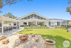 101A Salamander Way Salamander Bay NSW 2317 A Must See Property of 2024... Welcome to your dream escape, a breath-taking single level residence nestled in a serene rural setting, where tranquility meets elegance. This exceptional home, designed with no expense spared provides the perfect family haven. As you step inside, you are greeted by soaring high ceilings that enhance the sense of space and light, creating an inviting atmosphere perfect for both relaxation and entertainment. The heart of the home is an open-plan living area that seamlessly flows into a gourmet kitchen, complete with a hopper window, top-of-the-line appliances and elegant finishes plus a massive butler's panty. This living space is perfect for culinary creations and cherished family gatherings. Step into the master bedroom of your dreams, where luxury meets tranquility. This expansive retreat is designed to be a sanctuary, featuring generous dimensions that allow for both relaxation and style. A huge walk-in robe offers ample storage, elegantly organised to showcase your wardrobe and accessories while providing a sense of space and sophistication. The adjoining expansive ensuite is a true highlight, boasting a spa-like atmosphere with modern fixtures and a spacious walk-in shower. Beautifully appointed with high-end finishes, the ensuite creates a serene escape for your daily routines. With natural light streaming in and thoughtfully chosen details throughout, this master suite is not just a bedroom-it's a personal haven designed for comfort and indulgence. The thoughtfully designed home also offers its own self-contained residence offers versatility, making it ideal for guests, extended family, or even as a rental opportunity, providing both privacy and independence. Step outside to discover the epitome of entertaining, with a massive alfresco entertaining area where you can host summer barbecues or unwind with a glass of wine while soaking in the stunning bush outlook. The lush, landscaped surroundings provide a beautiful backdrop for outdoor living, ensuring you can enjoy the beauty of nature right at your doorstep. With a spacious two car garage, carport and parking for a boat or caravan, this meticulous home offers a luxurious lifestyle that can't be missed.