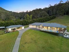 142 Petsch Creek Road Tallebudgera Valley QLD 4228 $4,100,000 If you cherish serenity, space and stunning rural views, this sprawling acreage will exceed all expectations. Unfolding across 7.54 acres of open green spaces and mature bushland, it's an idyllic backdrop to this single-level sanctuary. North-east facing and light-filled, extensive glazing throughout ensures these beautiful views are only ever a glance away. Impeccably presented, a contemporary kitchen acts as the heart of the home and draws everyone together. When relaxation calls, curl up in the cosy sitting area or the spacious lounge and dining room, crowned by soaring 3m ceilings and separated by a two-way fireplace. All five bedrooms are equally comfortable and generously sized, with the vast master suite tucked away in tranquillity. Complete with a walk-in robe, retreat, outdoor access and ensuite, treat yourself to an indulgent soak in the freestanding bath that gazes across rolling greenery. The guest suite also offers an ensuite, with a main bathroom servicing the remaining rooms. Outdoors, the expansive entertaining deck is perfect for hosting gatherings, complemented by a covered front patio and a firepit area for an evening under the stars. A studio, doubling as a gym, is a versatile addition that could be configured as an office or potential second dwelling, while horse enthusiasts are well catered for with stables, a tack room and paddocks. And after you've explored your natural wonderland on horseback, head home to cool off in the supersized pool. Part of a tight-knit community, Tallebudgera Valley is the green behind the gold. Wrapped in nature, it's hard to believe the sand and surf of Burleigh is under 20 minutes away. Multiple schooling options are close too, and you're less than 30 minutes from Gold Coast Airport for when travel beckons. Secure your private slice of paradise – arrange an inspection today! House Features: Single level family sanctuary capturing stunning rural views Enviable north-east aspect, filling the home with abundant sunshine Impeccably presented throughout Contemporary kitchen with quality appliances 3m ceilings crown the sprawling dining and lounge area, separated by a cosy two-way fireplace Sitting area connects with an open-air patio Spacious, sunlit master suite boasts a walk-in robe, ensuite with indulgent freestanding bath, retreat/office and access to a private deck Guest suite with ensuite Three further spacious bedrooms with built-in robes Main bathroom with separate toilet Expansive entertaining deck 13.5m x 3.5m pool and sundeck Covered front patio Double garage and driveway parking Outdoor shower Firepit area Studio Features: Open plan space – ideal as a gym, office or potential 2nd dwelling Wraparound deck Double carport Storeroom Property Features: 7.54 acres of manicured open green spaces and mature bushland Backs onto Petsch Creek Road Reserve 6.7m x 5.9m double-bay work shed Horse stable and tack room Convenient school bus pick-up from the driveway for local schools Paddocks Water tanks Location: Approx. 2 mins to Ingleside State school Approx. 11 mins to Tallebudgera shops, cafes and State School Approx. 11 mins to St. Andrews Lutheran College Approx. 19 mins to Burleigh Heads Approx. 22 mins to Currumbin Beach Approx. 26 mins to Gold Coast Airport