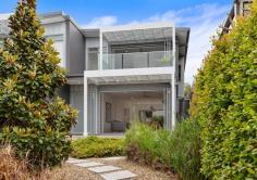 4A Gura Street Kiama NSW 2533 For those who cherish the vibrant energy of Kiama yet seek something more than apartment living, this luxurious townhouse with harbour and ocean views offers the perfect escape. Nestled in the highly coveted Pheasant Point precinct, this rare opportunity marries coastal elegance with the convenience of Kiama's township life. This residence is more than a home - it's an invitation to indulge in an elevated lock-up-and-leave lifestyle. Wake up to breathtaking views of Kiama's harbour and township, with the heart of town just a short, leisurely stroll away. But once you step inside, the world feels relaxed and calmer. Dual street access on quiet streets ensures privacy and ease of access, while the landscaped gardens provide a peaceful outdoor sanctuary. Inside, sophistication meets thoughtful design at every turn. Freshly designed interiors, adorned with a crisp white palette and contemporary polished concrete flooring, create a serene ambience in the living and dining areas. Imagine hosting intimate gatherings or enjoying quiet evenings in spaces that flow effortlessly from front to rear. Expansive floor-to-ceiling glass doors flood the home with natural light and invite the outdoors in, blurring the boundaries between outside nature and inside living. The potential for a plunge pool adds another layer of luxury, making this townhouse the ultimate retreat. The master suite upstairs is your private haven. Step onto a balcony, where stunning ocean and harbour views await, providing the ideal backdrop for sipping your morning coffee, reading, or simply basking in Kiama's sunlight and ocean breeze. Whether you're a professional seeking a designer lifestyle with minimal maintenance or a retiree looking for a luxurious coastal sanctuary, this home offers the perfect balance of comfort and sophistication. Don't miss your chance to secure this exceptional property and immerse yourself in the beauty and tranquility of Kiama's most sought-after locale.