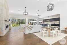 101A Salamander Way Salamander Bay NSW 2317 A Must See Property of 2024... Welcome to your dream escape, a breath-taking single level residence nestled in a serene rural setting, where tranquility meets elegance. This exceptional home, designed with no expense spared provides the perfect family haven. As you step inside, you are greeted by soaring high ceilings that enhance the sense of space and light, creating an inviting atmosphere perfect for both relaxation and entertainment. The heart of the home is an open-plan living area that seamlessly flows into a gourmet kitchen, complete with a hopper window, top-of-the-line appliances and elegant finishes plus a massive butler's panty. This living space is perfect for culinary creations and cherished family gatherings. Step into the master bedroom of your dreams, where luxury meets tranquility. This expansive retreat is designed to be a sanctuary, featuring generous dimensions that allow for both relaxation and style. A huge walk-in robe offers ample storage, elegantly organised to showcase your wardrobe and accessories while providing a sense of space and sophistication. The adjoining expansive ensuite is a true highlight, boasting a spa-like atmosphere with modern fixtures and a spacious walk-in shower. Beautifully appointed with high-end finishes, the ensuite creates a serene escape for your daily routines. With natural light streaming in and thoughtfully chosen details throughout, this master suite is not just a bedroom-it's a personal haven designed for comfort and indulgence. The thoughtfully designed home also offers its own self-contained residence offers versatility, making it ideal for guests, extended family, or even as a rental opportunity, providing both privacy and independence. Step outside to discover the epitome of entertaining, with a massive alfresco entertaining area where you can host summer barbecues or unwind with a glass of wine while soaking in the stunning bush outlook. The lush, landscaped surroundings provide a beautiful backdrop for outdoor living, ensuring you can enjoy the beauty of nature right at your doorstep. With a spacious two car garage, carport and parking for a boat or caravan, this meticulous home offers a luxurious lifestyle that can't be missed.