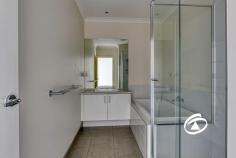 229 Pink Hill Blvd Officer VIC 3809 $640,000 - $700,000 Discover the ideal lifestyle prize for young professionals or families seeking a low-maintenance home in a prime location. Just a short stroll from schools, parkland, and shopping facilities, this townhouse offers both convenience and comfort. Striking Street Appeal with its modern facade, this townhouse welcomes you into a safe and light-filled living space. The layout features three spacious bedrooms, including a master suite with a walk-in robe and a full ensuite bathroom. The two additional bedrooms come equipped with built-in robes and are serviced by a family-friendly bathroom. Central to the home is a bright open-plan family and meals area, complete with sliding doors that lead to a private terrace. This space is perfect for entertaining and everyday living, featuring ducted heating, evaporative cooling as well as split system cooling for year-round comfort. The functional kitchen, dressed in brilliant white, boasts stone benchtops and quality appliances, seamlessly integrated into the living space. Step outside to your versatile terrace, the perfect spot to soak up the sun or unwind after a busy day.