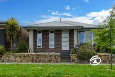 229 Pink Hill Blvd Officer VIC 3809 $640,000 - $700,000 Discover the ideal lifestyle prize for young professionals or families seeking a low-maintenance home in a prime location. Just a short stroll from schools, parkland, and shopping facilities, this townhouse offers both convenience and comfort. Striking Street Appeal with its modern facade, this townhouse welcomes you into a safe and light-filled living space. The layout features three spacious bedrooms, including a master suite with a walk-in robe and a full ensuite bathroom. The two additional bedrooms come equipped with built-in robes and are serviced by a family-friendly bathroom. Central to the home is a bright open-plan family and meals area, complete with sliding doors that lead to a private terrace. This space is perfect for entertaining and everyday living, featuring ducted heating, evaporative cooling as well as split system cooling for year-round comfort. The functional kitchen, dressed in brilliant white, boasts stone benchtops and quality appliances, seamlessly integrated into the living space. Step outside to your versatile terrace, the perfect spot to soak up the sun or unwind after a busy day.