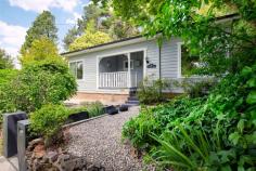 31 Northcote Road Leura NSW 2780 $970,000 - $1,050,000 Situated within a peaceful pocket of South Leura close to the golf course and Everglades Gardens, "Wren's Nest" is an attractively unique mountain cottage, and without a doubt, offers the simple pleasures of mountain life. Immaculately presented, this two bedroom home has been lovingly curated throughout. From its glass ceiling garden conservatory room to its clever retreat space secreted away in the tiered gardens, this home truly offers a mountain escape from a busy city life. When coming to the mountains in winter, the beauty of collecting kindling and starting a warming fire is undeniable. However practicality also presides with reverse cycle air conditioning units. Filled with natural light and offering every modern day convenience, this home offers turn-key comfort in its entirety. We encourage you to definitely add this one to your priority viewing list. Breakdown of Features: Open plan dining, new kitchen and living zone connects with 'garden' conservatory Open fireplace and reverse cycle air conditioning wall units Two bedrooms offering built in storage and elevated district view perspectives Immaculate subway-tiled main bathroom through to additional linen storage New spacious laundry combined with second shower bathroom from covered deck Multiple garden seating areas throughout cleverly designed tiered gardens Covered entry verandah and rear deck offering additional relaxation zones Garden retreat room offering extra versatile usage and storage; off-street parking Walking distance to Everglades Gardens cafe; 3 min drive 1.8kms to Leura Mall