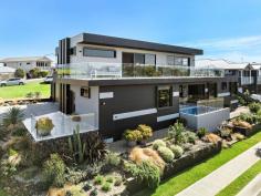 63 Merrick Circuit Kiama NSW 2533 $2,650,000 - $2,850,000 Step into this ultra-stylish family sanctuary, where every detail has been masterfully crafted for those seeking luxury, versatility and comfort. From the moment you enter, the grandeur of 63 Merrick Circuit will captivate you. Featuring high ceilings and expansive windows that bathe the home in natural light and offer ocean and mountain aspects. Picture yourself starting the day on the sunlit entertainer's balcony, overlooking manicured gardens and a sparkling plunge pool. This residence is not just a home-it's an escape to the beautiful, laid-back lifestyle of the South Coast. The open-concept design flows effortlessly, perfect for intimate family moments or lavish entertaining. Upstairs, paradise awaits, featuring multiple living spaces, an expansive balcony, and a gourmet kitchen with a butler's pantry-a perfect setting for gatherings filled with laughter and joy. Meanwhile, downstairs offers a versatile living space, kitchenette, and tiled garage, creating an ideal playroom, private retreat, or showroom for the car enthusiast. The accommodation comprises 5 bedrooms including a generous main with a walk-in wardrobe, ensuite, a cosy electric fireplace with sliding doors leading directly to the plunge pool. This home is thoughtfully designed for year-round comfort, with ducted air conditioning and ceiling fans, offset by 36 solar panels (11.8Kw system) and a rainwater tank ensuring both sustainability and cost efficiency. Nestled on a quiet corner block, both levels enjoy uninterrupted views of the protected Willow Gully Reserve. This home is an easy drive to Kiama's vibrant shopping and dining precincts and scenic coastal walks. A well kept children's playground is within walking distance.