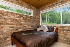 356 Corndale Rd Corndale NSW 2480 $1,325,000 At the end of the tree lined driveway - serenity awaits! A combination of brick, steel, timber and slate constructed over three levels. Ground level includes open plan living with high ceilings filled with natural light, timber floor boards, central combustion heater separating kitchen and dining area, pantry and ample storage in kitchen. Three spacious bedrooms, separate bath with hidden shower and separate toilet. Upstairs features large private master with ensuite and private balcony taking in magnificent rural outlook and night lights of Lismore as the backdrop. Also features an additional private turret style deck with views over a bushland setting and home to a wide range of birdlife. Other benefits include town water, garage space, separate laundry area with 3rd bathroom, set on 5 secluded acres just minutes to Bexhill village, 15 km to Lismore, 35km to Byron Bay and Ballina airport and beaches.