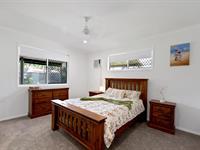 39 Royal Sands Boulevard BUCASIA QLD 4750 Welcome to the Royal Sands dream-a place where style meets family comfort, where every detail feels like home. This beautiful brick home, nestled on a 700m² block, effortlessly combines elegance and practicality, with a touch of serenity that only the Northern Beaches can offer. Step inside and let the charm unfold: the living room's bay window, adorned with plantation shutters, bathes the room in gentle light. Black stone benchtops add a modern flair to the kitchen, where the window overlooks your outdoor oasis. With a breakfast bar ideal for morning coffees or late-night chats, this kitchen promises to be the heart of your new home. Softly carpeted bedrooms, with fresh carpet laid just last month, bring warmth and comfort. Each bedroom features built-in robes, while the main bedroom comes complete with an ensuite, creating a quiet escape. A separate bathroom makes morning routines easy for the whole family. Outside, paradise awaits. Fitted UV roller blinds shade the back patio, setting the stage for year-round entertaining. Picture relaxing evenings in the heated spa, surrounded by the lushness of established gardens filled with fruit trees and a raised veggie garden, perfect for home-grown goodness. And for those with a love for projects, a 4.5 x 6m powered shed with lights makes for an ideal workshop, with additional storage behind. Practicality meets efficiency with a 6.6kW solar system and an unmetered bore pump, offering both eco-friendliness and cost-saving benefits. There's even a stainless steel sink and fillet table for those times you bring a big catch home, and double-gated access on both sides makes life that much easier. Just a stone's throw from the stunning beaches of the Northern Beaches, this home is more than a house-it's a lifestyle. Cafés, playgrounds, and everything you need are close by, offering the best of coastal living right at your fingertips. Discover the home that's ready for your next chapter in Royal Sands.