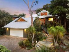 6 Onthonna Terrace Umina Beach NSW 2257 $1,450,000 - $1,550,000 Showcasing the perfect fusion of inspired architectural design, a magnificent natural setting, and a dream address just minutes to an array of breath-taking beaches, this coastal masterpiece is a rare find. Backing onto Brisbane Water National Park, a contemporary design awaits, welcoming family and friends through established gardens via sandstone paving and timber walkways. Inside, a superbly crafted dual-level design offers spacious family living across two levels, linked by a timber deck to a bonus self-contained guest accommodation. Outside, a selection of al fresco entertaining zones offer multiple spaces to sit back, relax, and take in the beauty of this incredible location. With scenic bushwalks available from your backyard and your choice of beaches just minutes away, this captivating property is ready and waiting to elevate your everyday experience. Features include: – Architecturally designed masterpiece offering a dual-level residence + bonus self-contained guest studio, all perfectly nestled into stunningly scenic surrounds with immersive views. – Highset front entertaining deck, completely covered and taking in elevated leafy views, the perfect spot to sit back, relax, and savour this dream location. – Light-filled main residence offering high ceilings, gleaming timber tones, and extensive glazing drawing the outdoors in, seamlessly connecting spacious interiors with stylish al fresco entertaining zones. – Gourmet entertainers kitchen complete with sleek stone benchtops, tiled splashbacks, an abundance of bench and cupboard space, quality appliances, and gas cooking facilities. Perfectly positioned to look out across the backyard and entertain al fresco entertaining. – Open-plan social zone connecting the kitchen and dining area to the main living area before spilling out to covered timber decks on either side – a dream flow for effortless living and elegant entertaining. – Two large bedrooms resting on the entry level, each with built-in robes, and serviced by a spacious family bathroom. – The ultimate parent retreat offers a master suite plus en-suite bathroom, built-in robes, and a private balcony with scenic views and ocean glimpses. – Tiered backyard, fully fenced with established landscaped gardens, level grassy areas, multiple sitting spaces, and an indulgent spa with cabana, all designed to make the most of this exceptional position. – Separate self-contained guest studio with own access, positioned above the garage. – Double automatic garage + additional off-street parking for a further two vehicles. – Exceptional lifestyle location: backing onto Brisbane Water National Park while being just minutes to the popular, patrolled surf of Umina Beach (2.8 km), the picturesque serenity of Pearl Beach (4.5 km), and your choice of local shops, schools, cafes, and services. – Council rates: $1,662 (approx.) pa. Extras include: split-system air conditioning and an extensive solar system (minimal power bills) with 19 panels servicing the whole house. Properties of this calibre and location are far and few between. Onthonna Terrace rests within the sought-after ‘South Umina’ area, prized for it’s deep sense of serenity while being within easy reach of every lifestyle convenience and a stunning coastal corridor of beaches, bushwalks, and waterways. For those heading further afield, local train stations are close by, and Wahroonga is less than an hour’s drive (62 km) for easy access to Sydney and surrounds.