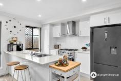 33 Neumann Drive Yarrabilba QLD 4207 $659,000 This home’s kitchen is thoughtfully designed with a 900mm gas cooktop and oven, offering a reliable and high-performing setup for culinary enthusiasts or those who simply enjoy cooking. A stone benchtop provides ample workspace for meal preparation, with additional room for appliances or decor. Numerous cabinets and a generous pantry cabinet ensure easy storage of ingredients, cookware, and kitchen essentials, helping to maintain an organized, clutter-free environment. Positioned to overlook the open plan living and dining area, this layout allows those in the kitchen to stay connected with family or guests, and an air conditioner in this space keeps it comfortable year-round. A separate living room with air conditioning near the entrance creates a distinct space apart from the main open living area. This layout is ideal for those seeking a cozy retreat for quiet relaxation or even a formal sitting area to welcome guests. This room can also serve as a versatile family lounge, media room, or dedicated playroom, adapting easily to various needs without interfering with the activities in the main living area. Each bedroom is fitted with ceiling fans, ensuring comfort during warmer months. The master bedroom, designed as a private retreat, feature s ceiling fan, a walk-in robe for abundant storage, and an ensuite bathroom for added privacy and convenience. The additional bedrooms all have built-in robes, providing organized closet space and. Centrally located, the main bathroom is strategically positioned to serve the other bedrooms and the main living areas efficiently. It includes a shower, bathtub, and a separate toilet, which helps streamline morning routines and enhances functionality for shared use. A well-equipped laundry inside the home provides easy access to the outdoors and includes a large storage cabinet, ideal for household supplies, linens, and cleaning essentials. The laundry’s positioning near outdoor access simplifies tasks like line drying or keeping mudrooms clean after gardening. The alfresco area, covered and complete with downlights and a ceiling fan, serves as a fantastic outdoor entertaining area. Overlooking the fully fenced yard, this space is perfect for hosting gatherings, enjoying outdoor meals, or simply relaxing in a shaded spot while keeping an eye on children or pets playing in the yard. With a double remote-control garage, convenient and secure parking is assured, along with space for additional storage if needed. Key Features: •Built in 2018, this home combines modern design with functional layouts, providing both style and practicality for contemporary living. •The property is equipped with a 6.5 kW solar system, providing an efficient and eco-friendly energy solution to significantly reduce electricity costs. •The kitchen is equipped with a high-quality 900mm gas cooktop and oven, perfect for avid cooks and family meal preparation. A durable stone benchtop adds elegance and offers ample workspace, while abundant cabinetry and a spacious pantry provide plenty of storage to keep the kitchen organized and clutter-free. •Open plan living and dining areas create a central hub for family activities and entertaining. Positioned adjacent to the kitchen, this area allows seamless interaction between spaces. An air conditioner ensures comfort, making it a cozy spot for gatherings or quiet relaxation. •A separate living area located at the front of the home with air conditioning provides a comfortable and versatile space away from the main living areas. Ideal for a formal lounge, home office, or media room, this space offers privacy and a quiet atmosphere, adaptable to suit varying lifestyle needs. •The master bedroom is a private retreat, featuring an ensuite bathroom for convenience, a walk-in robe for ample storage, a ceiling fan further enhances ventilation, making this room comfortable and inviting. •The remaining bedrooms are designed with comfort in mind, each featuring a ceiling fan and built-in robes. These rooms offer organized storage and pleasant airflow, creating cozy, restful spaces for family members or guests. •Positioned for easy access to all bedrooms and main areas, the main bathroom is functional and family-friendly, featuring a shower, a relaxing bathtub, and a separate toilet for added convenience during busy routines. •The laundry is located within the home and includes a spacious storage cabinet, making it easy to manage household tasks. With direct access to the outdoors, it simplifies tasks such as hanging out laundry or quickly stepping in after outdoor activities. •An undercover alfresco area, complete with downlights and a ceiling fan, offers an inviting outdoor space for dining, relaxation, or entertaining. Overlooking the fully fenced yard, this area is perfect for enjoying the outdoors in a shaded, comfortable setting. •The double remote-control garage provides secure parking for vehicles and additional storage space, ensuring practicality and peace of mind.