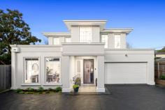 2/25 Park Close Vermont VIC 3133 This elegant home, rich in character, offers an exceptional lifestyle with its polished timber parquetry floors, sleek white kitchen, and luxurious bathrooms. Featuring four generously sized bedrooms and 3.5 bathrooms, the residence maximizes space with discreet custom cabinetry for added storage. At the heart of the home is the kitchen, highlighted by a waterfall-edge stone breakfast island, ideal for meals and socializing. The kitchen is a chef's delight with two ovens, gas cooking, and a walk-in pantry. A convenient powder room and laundry enhance the functionality of the main level. The inviting lounge area, bathed in natural light from high-set windows, creates a warm atmosphere. Step outside to the paved alfresco area for entertaining or the fully fenced lawn, perfect for children and pets. The main bedroom on the main level offers tranquility and privacy with an ensuite, walk-in robe, and direct garden access. The ensuite features a freestanding tub, twin sinks, and generous mirror and storage space. Upstairs, three additional bedrooms share a retreat/rumpus room and a family bathroom with a separate powder room. Bedroom two on this level includes an ensuite with a twin vanity. Completing the property are low-maintenance gardens, a garden shed, and a double garage with internal and rear yard access. Located in a quiet, tree-lined cul-de-sac off Canterbury Road, the home is conveniently close to parks, primary schools, shopping, Eastlink, and public transport. This residence is the perfect combination of luxury and practicality. Highlights: 4 generously sized bedrooms 3.5 bathrooms Discreet custom cabinetry for additional storage Two ovens, gas cooking, and walk-in pantry Convenient powder room and laundry on the main level Access to paved alfresco area for entertaining Fully fenced lawn, ideal for children and pets Close to parks, primary schools, shopping, Eastlink, and public transport