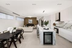 12A Ogmore Court Bankstown NSW 2200 $1,549,950 Welcome to this brand-new, tropical-inspired duplex, tucked away in a peaceful cul-de-sac in the heart of Bankstown. This architecturally designed home is the epitome of modern elegance and functionality, offering the perfect balance of style, comfort, and convenience for families. *Unmatched Design & Livability* Step inside to discover a light-filled open-plan layout, where the centerpiece is the beautifully crafted kitchen. Featuring: - A glass-enclosed walk-in pantry for seamless organization. - A breathtaking 3-meter stone island waterfall bench, ideal for entertaining or casual family meals. - Premium appliances, ensuring a chef's delight in every meal preparation. This space flows effortlessly into the outdoor alfresco area, complete with a covered pergola and a low-maintenance backyard- perfect for year-round entertaining or relaxing with loved ones. *Prime Location* Situated just a 15-minute walk from the upcoming Bankstown Metro train station (completion expected in 12 months), this home puts you within easy reach of everything: shops, schools, clubs, churches, temples, and more! *Key Features* - 5 Spacious Bedrooms: Four upstairs, including a luxurious master suite with an en-suite and walk-in robe. The fifth bedroom/ home office is conveniently located downstairs - ideal for guests or elderly family members. - Luxurious Electric Fireplace: A sleek centerpiece that adds warmth and charm to the living area, perfect for cozy winter evenings. - Sky-Lit Brilliance: Strategically placed skylights ensure an abundance of natural light, creating a bright and airy ambiance throughout the day. This property is not just a home; it's a lifestyle upgrade waiting for its new owners. Don't miss the opportunity to secure your dream family home in this highly sought-after location.