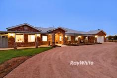 54 Laurel Avenue Nichols Point VIC 3501 Damian Portaro, Principal & Chairman's Elite Sales Agent at Ray White Mildura, proudly presents 54 Laurel Avenue, Nichols Point-a stunning fusion of country charm and modern luxury, nestled on a rare 14.5-acre property. Perfectly designed for expansive living, this exceptional home offers the best of rural tranquility and sophisticated comfort. From the moment you arrive, the property's appeal is undeniable. Built with character and style, the country-style home is enveloped by wide verandahs and crafted from recycled bricks, giving a nod to timeless quality and craftsmanship. Inside, discover over 57 squares under roof, where generous spaces flow seamlessly, designed for effortless family living and memorable entertaining. This six-bedroom residence is impeccably appointed, with five bedrooms featuring built-in robes, while the master suite stands as a private sanctuary with a walk-in robe and an elegant ensuite with dual vanities. The heart of the home is the stone benchtop kitchen, complete with a butler's pantry, designed to inspire culinary creativity and gatherings. Open-plan meals and dining areas encourage family togetherness, while a separate lounge offers a cozy retreat for quieter moments. Outdoors, the vast 14.5-acre estate truly shines. Bordering crown land with limited neighbors, this property is an oasis of privacy and space. The house yard is fully fenced and irrigated, creating a secure environment ideal for family relaxation and entertaining. For larger gatherings, the impressive outdoor area, complete with an open fireplace, offers the perfect space to host friends and enjoy evenings under the stars. Meanwhile, children will delight in the dedicated play area, providing hours of outdoor fun. The property's impressive amenities extend to working and storage needs with a 20m x 9m shed and an additional 20m x 7m implement shed, providing ample space for equipment and projects. A 34.8-meg water AUL and 2 meg of permanent water supply ensure the land's agricultural potential, enhanced by overhead irrigation across the farm area. A robust 12kW solar system adds to the property's sustainability, supporting both the environment and future cost efficiency. 54 Laurel Avenue offers a truly unique opportunity to embrace a refined rural lifestyle with ample space for families, farming pursuits, or entertaining on a grand scale. This Nichols Point gem promises a lifestyle where every need is met.