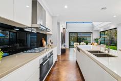 2/25 Park Close Vermont VIC 3133 This elegant home, rich in character, offers an exceptional lifestyle with its polished timber parquetry floors, sleek white kitchen, and luxurious bathrooms. Featuring four generously sized bedrooms and 3.5 bathrooms, the residence maximizes space with discreet custom cabinetry for added storage. At the heart of the home is the kitchen, highlighted by a waterfall-edge stone breakfast island, ideal for meals and socializing. The kitchen is a chef's delight with two ovens, gas cooking, and a walk-in pantry. A convenient powder room and laundry enhance the functionality of the main level. The inviting lounge area, bathed in natural light from high-set windows, creates a warm atmosphere. Step outside to the paved alfresco area for entertaining or the fully fenced lawn, perfect for children and pets. The main bedroom on the main level offers tranquility and privacy with an ensuite, walk-in robe, and direct garden access. The ensuite features a freestanding tub, twin sinks, and generous mirror and storage space. Upstairs, three additional bedrooms share a retreat/rumpus room and a family bathroom with a separate powder room. Bedroom two on this level includes an ensuite with a twin vanity. Completing the property are low-maintenance gardens, a garden shed, and a double garage with internal and rear yard access. Located in a quiet, tree-lined cul-de-sac off Canterbury Road, the home is conveniently close to parks, primary schools, shopping, Eastlink, and public transport. This residence is the perfect combination of luxury and practicality. Highlights: 4 generously sized bedrooms 3.5 bathrooms Discreet custom cabinetry for additional storage Two ovens, gas cooking, and walk-in pantry Convenient powder room and laundry on the main level Access to paved alfresco area for entertaining Fully fenced lawn, ideal for children and pets Close to parks, primary schools, shopping, Eastlink, and public transport