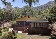 2417 Pine Creek - Yarrabah Road East Trinity QLD 4871 $895,000 Patrick Kenny proudly introduces a golden opportunity to escape the hustle and bustle of city living and have a second income as well. Huge outside tiled patio, stunning resort size pool completed with a spa seat and waterfall. All up approximately 340m under roof, 30mins to Cairns MAIN RESIDENCE • Three extra large bedrooms all with built in robes, the master bedroom with an ensuite, louvre windows and sliding doors to the timber deck with sea views • The living area has timber look vinyl planks as flooring, sliding doors open out to the second timber deck with views of the native trees and sea views • The kitchen is well appointed with wide fridge space, pantry, dishwasher, gas cooktop and plenty of servery area • Internal laundry with extra space, three door linen robe • 4.8 klw solar panels plus solar hot water • Crime safe mesh on all doors, wired for a generator • Air conditioned throughout, tinted windows • Color bond roof, remote sliding gate entry to both residences SECOND RESIDENCE/GRANNY FLAT • A neat tidy kitchen • Two generous sized bedrooms with air conditioning, one with built robes • Tiled throughout the home • For all your business or study needs there is an office room • Air conditioned in the main living area • Separate laundry from the main residence