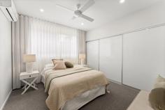 519/33 Kersley Road Kenmore QLD 4069 Welcome to Habitat on Kersley - a remarkable collection of townhomes with exclusive bushland grounds. Designed by architects Fulton Trotter, this beautiful townhome offers exceptional living just 12-kilometers from Brisbane's CBD. Maximising its location with floor-to-ceiling glass in its main living spaces, this property is intentional in its celebration of its surrounds. For the seasoned entertainer, this home boasts a chef's kitchen with Bosch appliances and a butler's pantry, its floorplan flowing from the internal dining space to the covered alfresco with ease. Accommodation includes three bedrooms, the primary suite offering a private ensuite, while comprehensive appointments include a double garage, guest powder room, high ceilings, air conditioning and ceilings fans throughout. Positioned within the well-regarded suburb of Kenmore, this property is perfect for families, offering schools within walking distance. Local amenities include Kenmore Village and Indooroopilly Shopping Centre, while public transport options include nearby Indooroopilly Station. Inclusions: Superb main living space with floor-to-ceiling louvres Open plan dining room, flowing to covered timber deck Chef's kitchen with stone countertops & butler's pantry Primary bedroom with ensuite and built-in robe Two additional bedrooms, each with built-in robes Luxurious family bathroom with bathtub High ceilings, split system air conditioning and ceiling fans Double remote-control garage Internal laundry facilities Low maintenance terraced garden Walking distance from Goodstart Early Learning and Kenmore South State School Minutes from Our Lady of the Rosary School and Kenmore State High School Moments from Kenmore Village Shopping Centre and Indooroopilly Shopping Centre Just 12kms from Brisbane CBD with public transport options including bus and rail