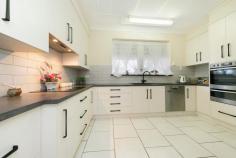 2A Chamberlain Road Willaston SA 5118 Discover a solid brick gem with character and space at 2A Chamberlain Road, Willaston. Situated on a generous 972m2 block, this charming three-bedroom home offers comfort, practicality and an array of features for families and entertainers alike. Step into a residence with 9ft ceilings that amplify the sense of space. The master bedroom is a true retreat, boasting a bay window, ceiling fan, built-in robes, roller shutters, split system air conditioning and a private ambience. Bedrooms two and three are also generously sized each featuring ceiling fans, with bedroom two offering a built-in robe. The expansive living spaces include a large formal lounge and dining room, perfect for hosting guests. A great size rumpus room complete with a bay window provides additional versatile spaces for relaxation or hobbies. The family room and meals area are ideal for everyday living flowing seamlessly into the heart of the home- a well-appointed kitchen with soft-close drawers, a dishwasher, filtered water, ample cupboard space, and a ceiling fan. Catering to the needs of a busy household, the practicality continues with a large laundry featuring abundant storage and a second toilet, leading into the sun room. Comfort is ensured year-round with two split system air conditioners and combustion heating. Security is a priority, with roller shutters on most windows and a fully alarmed security system. Step outside to a beautifully maintained rear garden, accessible from the expansive entertaining area. Immaculate front and rear landscaping enhance the property's curb appeal and provide tranquil outdoor spaces. The oversized double garage with an automatic door ensures ample parking and storage. Located close to schools, major and local shopping centres, public transport and parks, this home also offers convenient access to the Northern Expressway ensuring an easy commute to Adelaide's CBD. Perfectly blending style, space and convenience, 2A Chamberlain Road is a must-see for discerning buyers. Don't miss your opportunity to secure this immaculate home in a prime location.