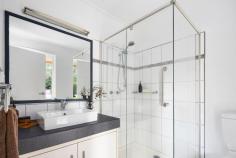 65 Alicudi Avenue Frankston South VIC 3199 $1,785,000 - $1,950,000 ~ Spacious family living designed with trade appeal ~ Pairing the perfect light-filled layout for growing families with private outdoor space and functionality, this established allotment of approximately 2,746sqm keeps everyone happy with multiple living zones, a resort-style swimming pool and expansive shedding perfect for trade-based business. Peacefully positioned within one of Frankston South's most sought-after avenues with direct access to Frankston Nature Conservation Reserve, the home's private frontage keeps features concealed beyond a neat garden, opening once inside to soaring ceiling heights and a rear north-facing orientation. A beautifully renovated kitchen acts as a central hub, framing serene pool views around its stone benchtops and modern appliances, while a fire-side lounge and dining space balances a casual living zone to the rear. It's the resort-style gardens and spacious covered alfresco deck that instantly makes summer hosting an exciting prospect, with the concrete in-ground pool, a family highlight. Discretely positioned behind, an expansive extra-height two-bay shed with sliding door access complements covered caravan/boat/trailer parking, and an additional workshop, whilst direct reserve access, vegetable gardens, a double garage and large grassy play space to the side, further enhance the appeal. Each of the four bedrooms, including the master with ensuite and walk-in robe, provides a restful ambience with garden views and plush carpet underfoot, while a central bathroom with private toilet, tub and separate shower serves both family and guests. A separate study/potential fifth bedroom delivers a quiet remote-working space for those who need it, with gas ducted heating and evaporative cooling, providing comfort throughout. Set within easy reach of Paratea Preschool, Frankston Heights Reserve, the Humphries Road Top Shops, bus stops, and both Mount Eliza Village and Frankston Bayside Shopping Centre.