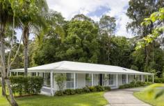 557 Tallebudgera Creek Road Tallebudgera Valley QLD 4228 We've found it – a peaceful and picturesque estate where your family – and your equestrian passions – will thrive. Occupying 4.29 acres of lush usable land and fringed by 123m of tranquil Tallebudgera Creek frontage, it offers the perfect backdrop for an idyllic lifestyle. Here, a beautifully renovated and light-filled sanctuary also beckons, fusing coastal and country elegance across a single level. A home that is both inviting and stylish, its beating heart is the open plan kitchen, living, and dining zone. Along with offering a seamless connection outdoors, this social hub is primed for togetherness. Kids or guests can gather around the large island bench and share stories while meals are prepped or enjoy time together relaxing in the lounge. A second cosy living room provides a spot to escape, complemented by four bedrooms and two modern bathrooms. Space and sunlit define the blissful master suite, outfitted with a handy office space, walk-in robe and ensuite, while the remaining bedrooms boast built-in desks and robes. Outdoors, vast expanses of greenery are punctuated by towering trees, with multiple vantage points to entertain guests or soak in the tranquil view from the wraparound verandah. Alternatively, retreat to the creek-side firepit to share stories and make memories under the stars. Plus, for equestrian enthusiasts, this property is a dream come true, with horse stables, a tack room, 6 paddocks and an impressive olympic size ELD dressage arena. A location to love, it's an easy drive to Tallebudgera State School and St. Andrews Lutheran College, with beautiful southern Gold Coast beaches and coastal eateries beckoning within 11 – 16 minutes by car. This means the best of both worlds and it's waiting just for you. Explore this serene, family-friendly haven first-hand - arrange your inspection today! House Features: Stunning single-level sanctuary fusing coastal and country charm Beautifully renovated, with light-filled interiors Whitewashed exposed brick and VJ panelled feature walls add modern charm Kitchen, living and dining zone is expansive, open plan and inviting, with a free-flowing connection outdoors Sleek kitchen enhanced with a large island bench, walk-in pantry, stainless steel tapware, pendant lights and premium appliances, including an induction cooktop Second cosy lounge room Spacious and sunlit master suite includes an office space, walk-in robe and a modern ensuite Three bedrooms feature a built-in desk and built-in robe Elegant main bathroom with separate toilet Large laundry with abundant storage Ceiling fans and air-conditioning Covered verandah wraps around three sides of the home Property Features: 4.29 acres of usable land, fringed by 123m Tallebudgera Creek frontage 6 paddocks with Stockguard electric fencing Supersized 15m x 6m shed Circular driveway Creek-side firepit Horse stables and tack room Paddocks Olympic sized ELD dressage arena 13.2kw solar system Location: Approx. 4 mins to St. Andrew's Lutheran College Approx. 5 mins to Tallebudgera State School and shops Approx. 11 mins to Burleigh Heads Approx. 13 mins to Palm Beach Approx. 16 mins to Currumbin Beach Approx. 19 mins to Gold Coast Airport Approx. 30 mins to Surfers Paradise