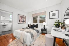 1 / 9 Glenwood Avenue Coogee NSW 2034 Tucked away at the end of a quiet cul-de-sac, this garden front apartment is an ele-gant entertainer, dream downsizer or quality investment with loads of lifestyle appeal. Set at the rear of a 2019 redeveloped boutique security complex, this secluded sanc-tuary is just two blocks from Coogee Beach's golden sand, surf and vibrant café cul-ture. Retaining the generous proportions and Art Deco vibe of the original building, this stylish home offers contemporary comfort, flowing indoor/outdoor living and ex-cellent accessibility with lift to basement parking. A hidden gem at the heart of this popular beach suburb, footsteps to sports and leisure facilities, shops, cafes, eateries and City buses with one of Sydney's most iconic beaches at the doorstep. • Polished timber floors, high ceilings with downlights • Living/dining flows to covered garden-front terrace • Stone gas kitchen with SS appliances & dishwasher • Exclusive use of 60sqm hedged & lawned garden • 2 double bedrooms with built-ins, chic master ensuite • Stylish main bathroom with bath, concealed laundry • Lift from security parking plus chair lift to entry door • Exceptionally quiet and private, only 7 units in complex • Convenient to Coogee Surf Club and ocean baths • Ideal for young families with parks and schools nearby